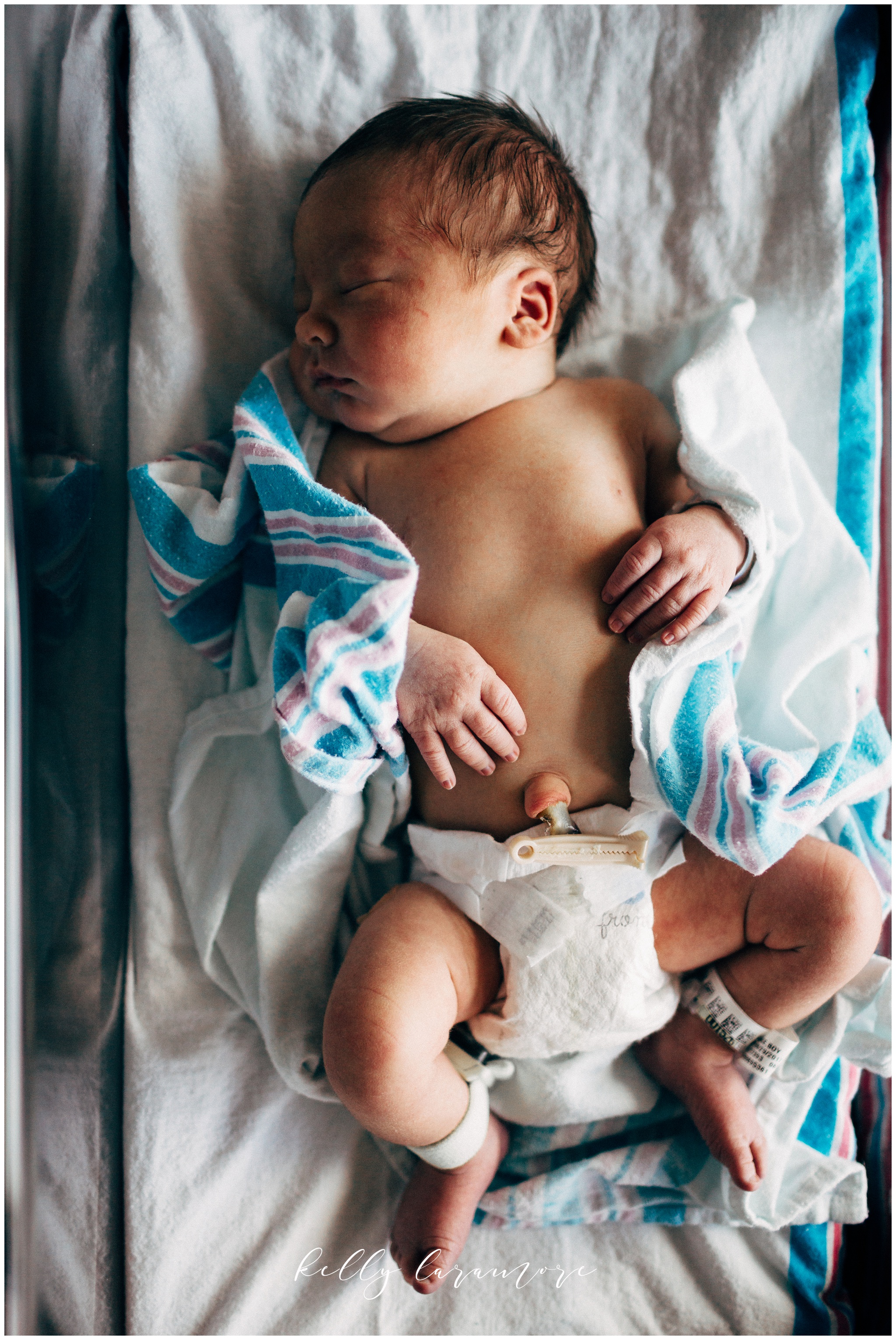 newborn in diaper, hospital newborn blanket, hospital postpartum room, sleeping newborn
