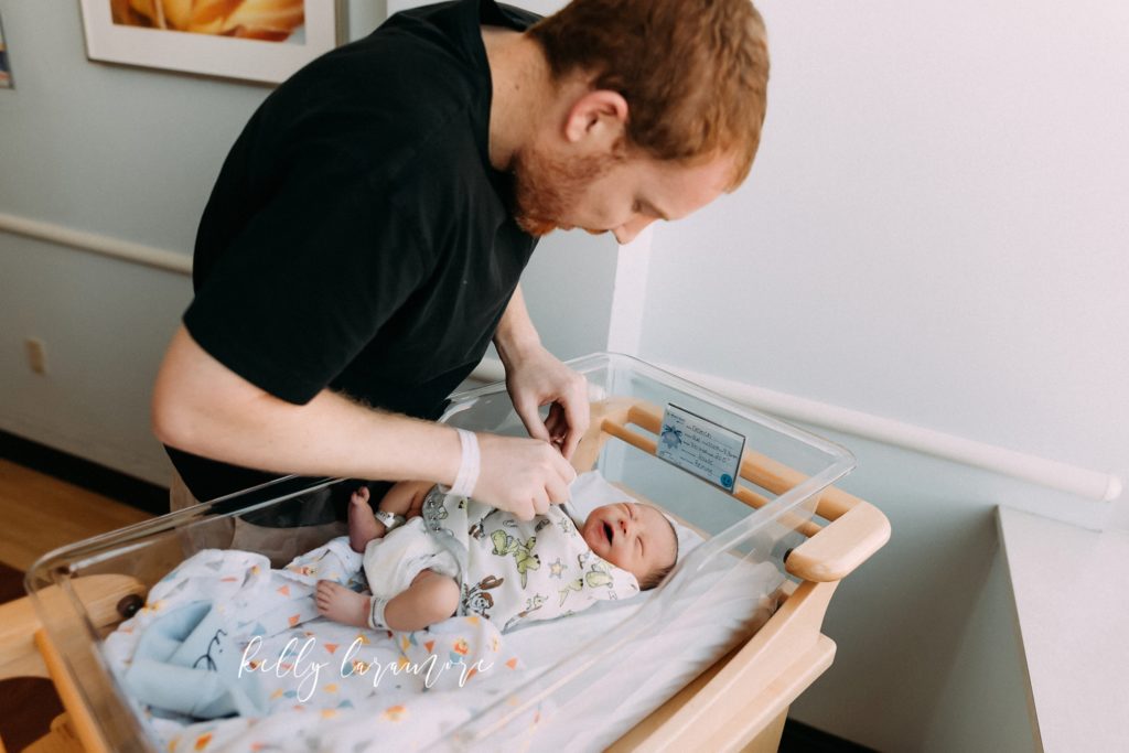 New dad changing newborn boy at missouri baptist medical center Mo Bap Baby room