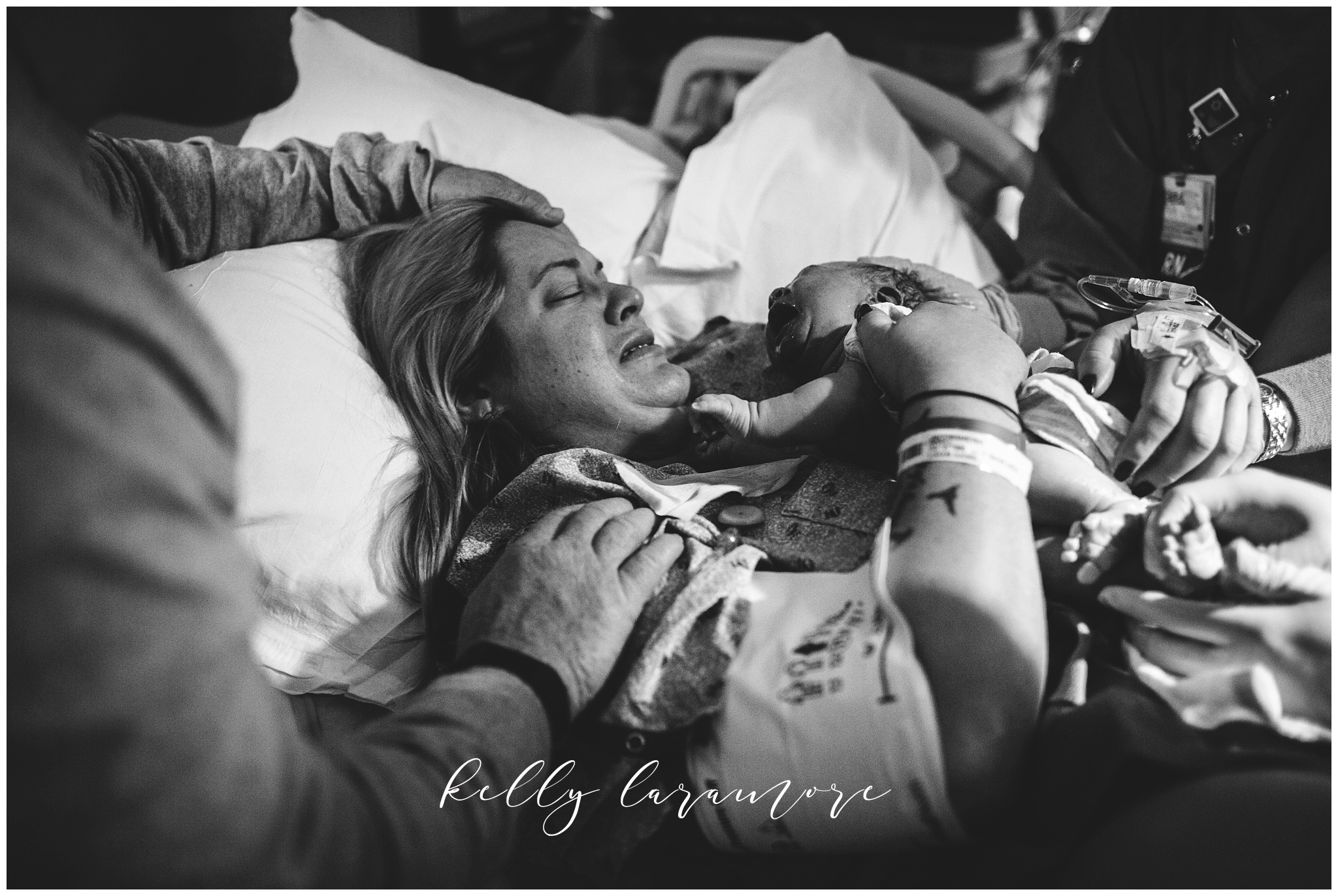 st louis birth story photographer, st louis family photographer, missouri baptist birth center-birth, delivery room, mom holding baby for first time
