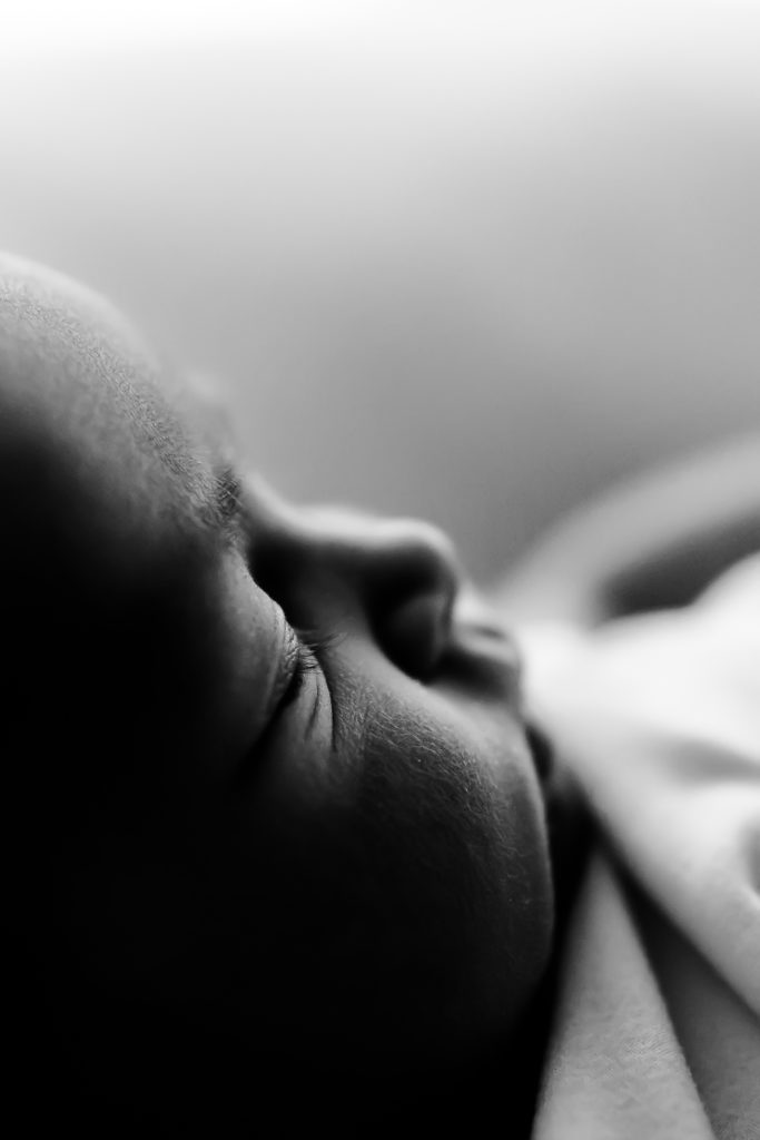 profile shot of newborn baby in a photography studio at a newborn session