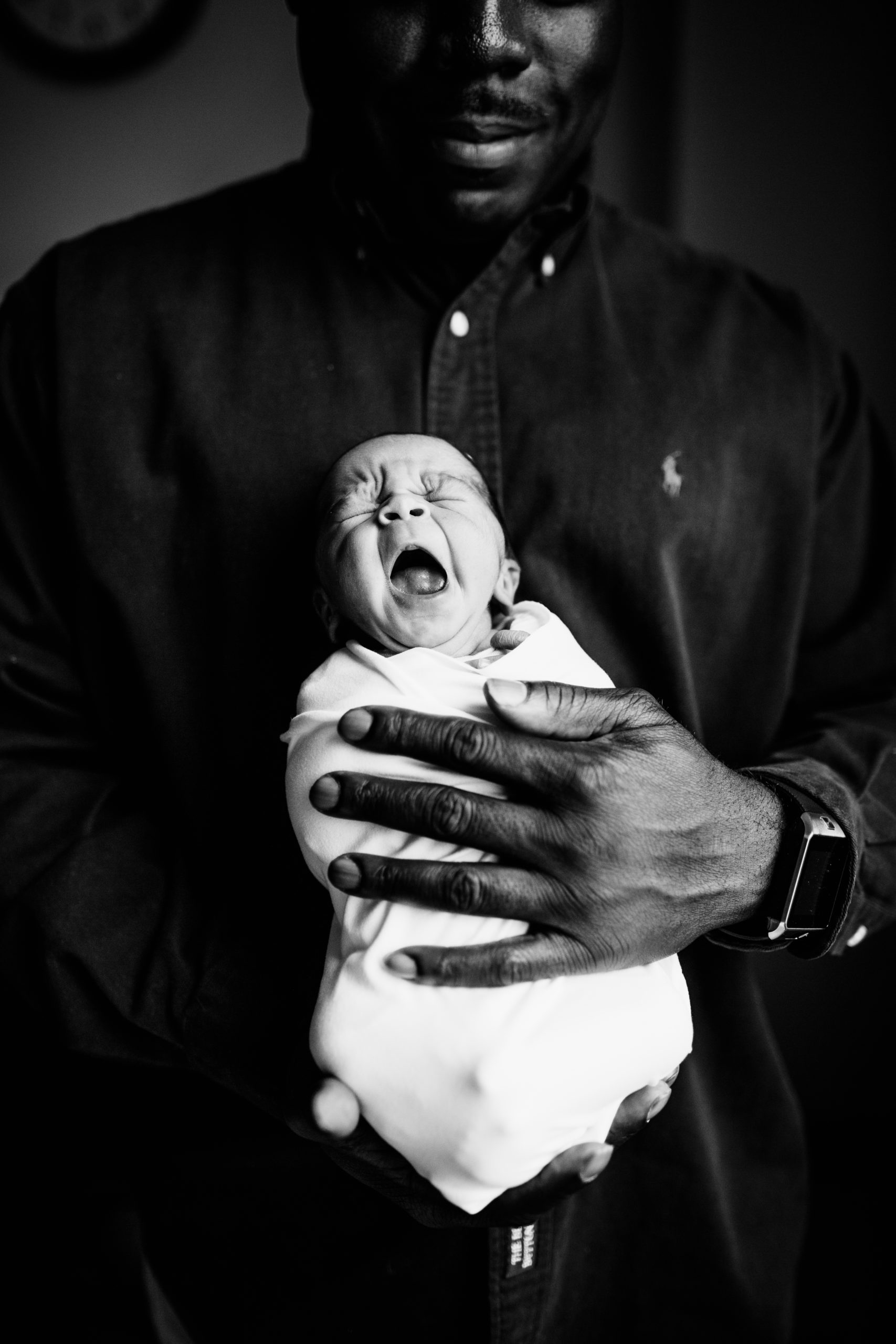 dad holding newborn girl, dad at barnes jewish delivery room, newborn baby yawn