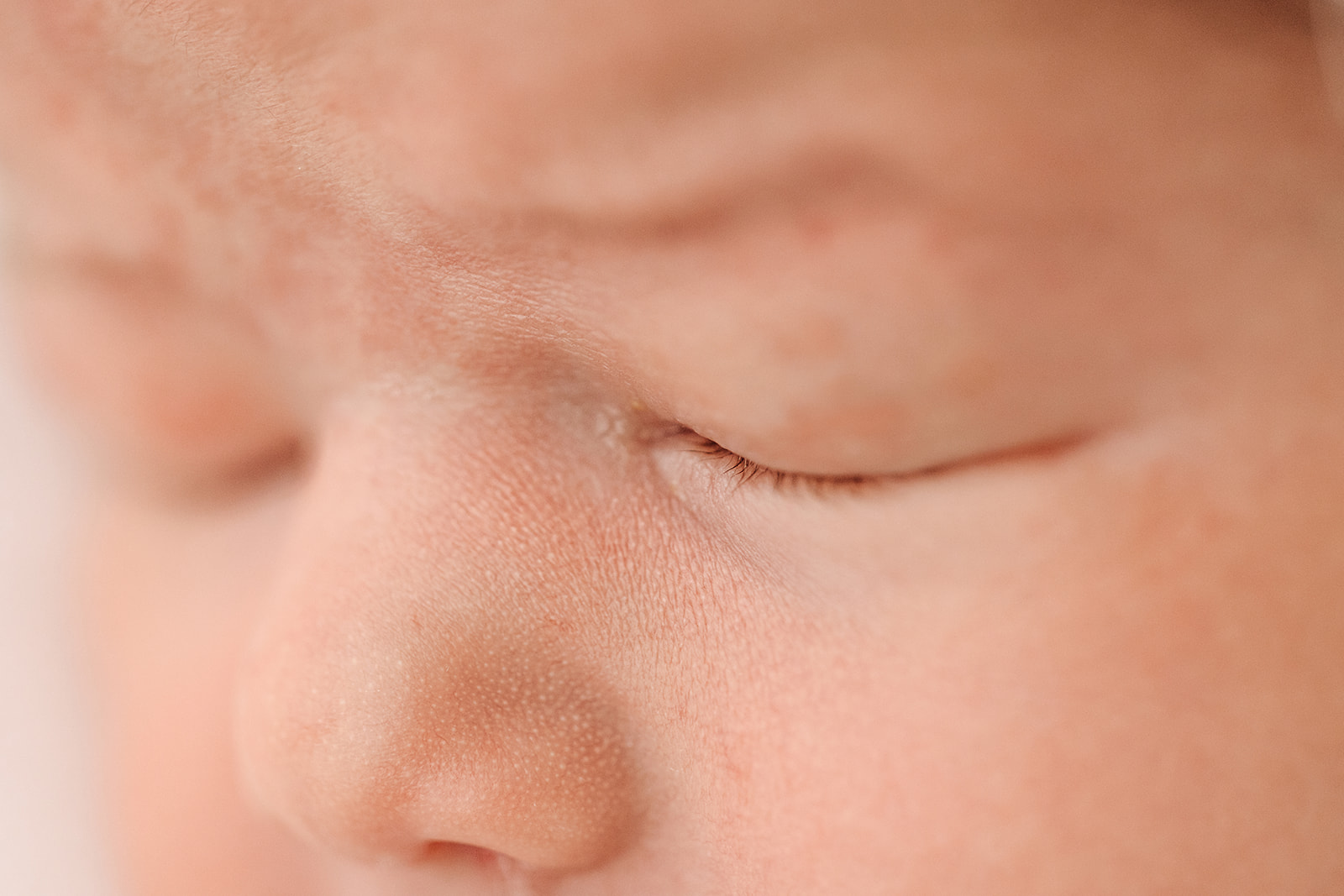 Details of a sleeping newborn baby's face thanks to IVF St Louis