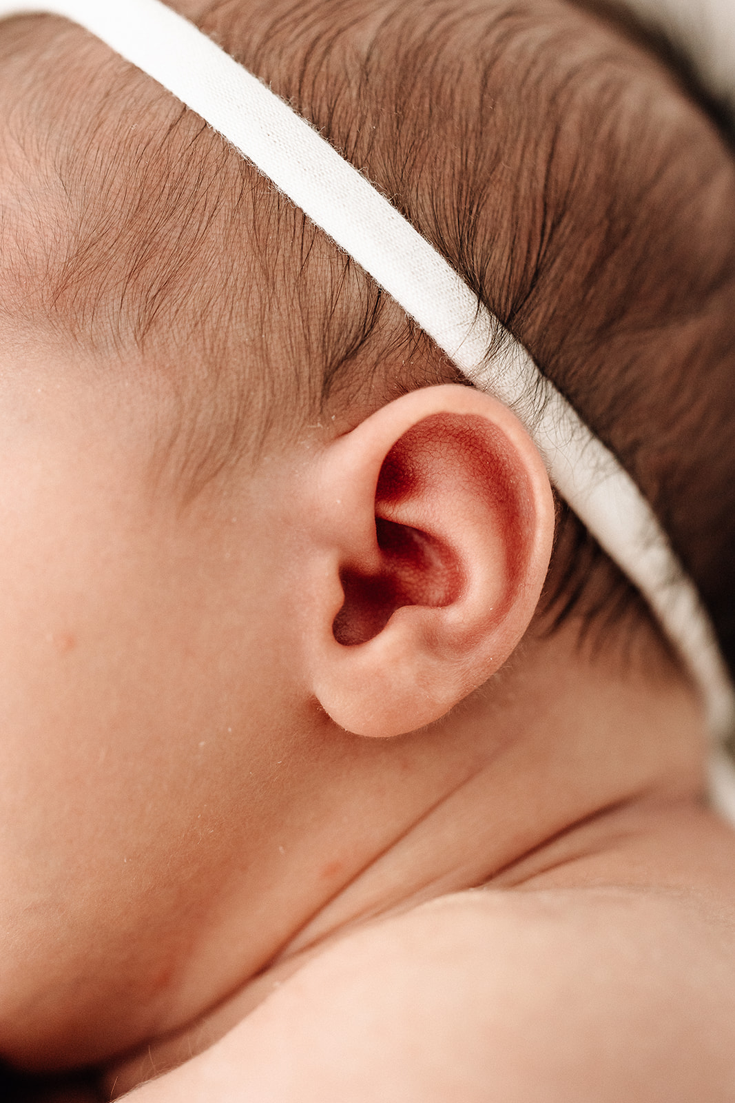 Details of a newborn baby's ear after visiting Robbins doula services